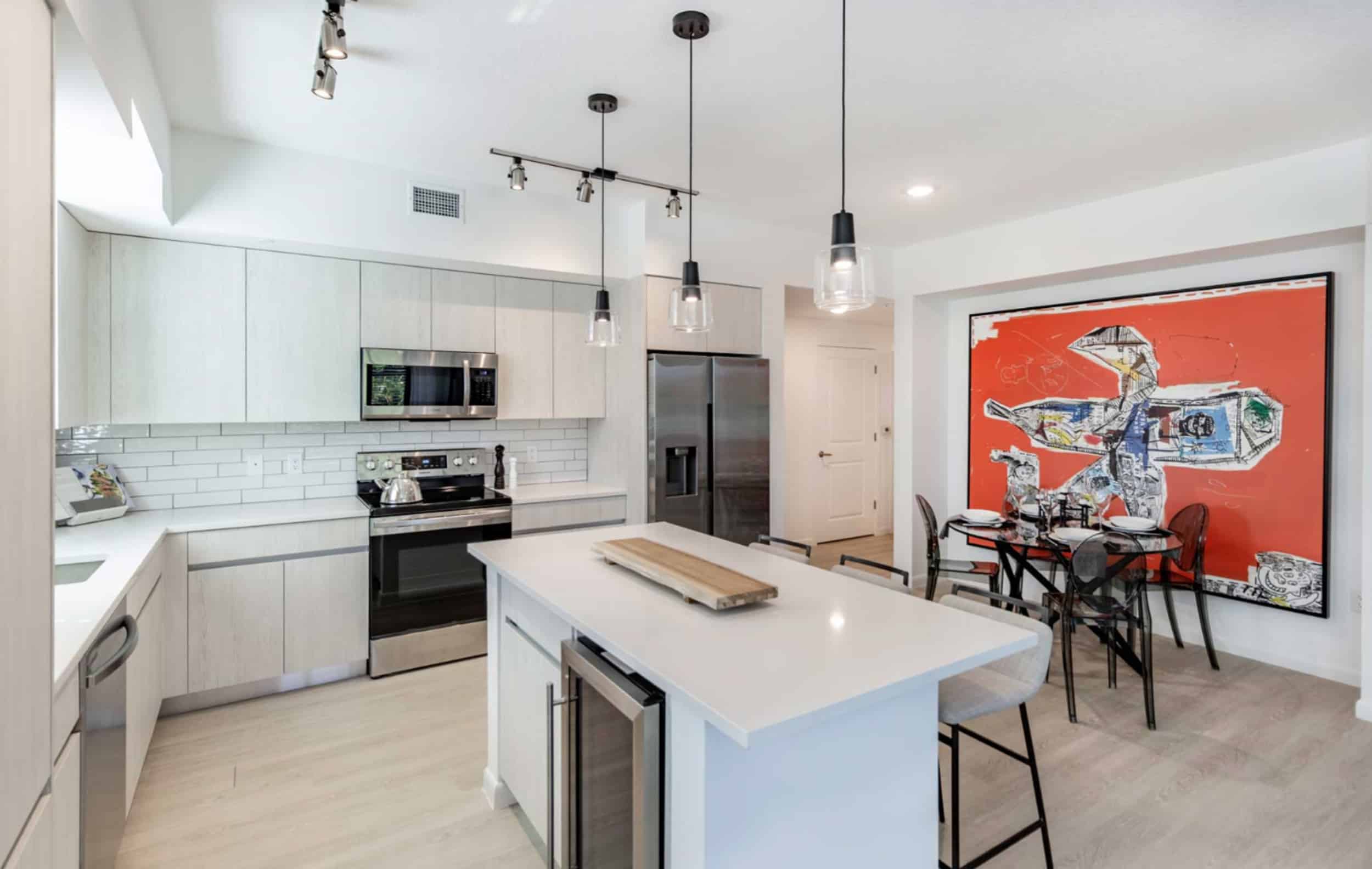 Modern amenities like stainless steel appliances and kitchen islands inside apartment homes at Casa Mara