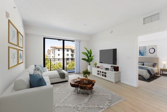 Modern apartment living rooms with access to an outdoor balcony at Casa Mara