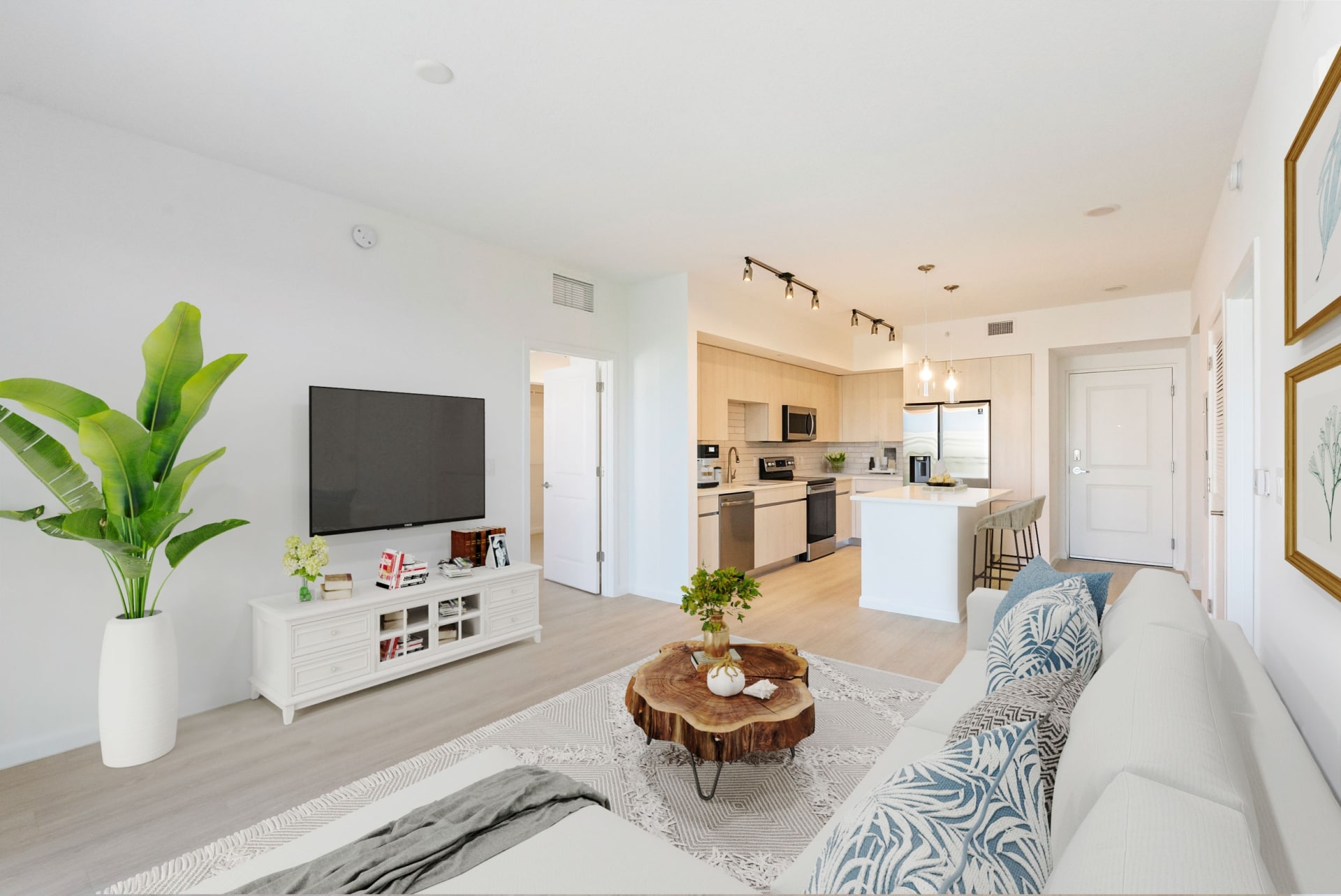 Luxury apartment amenities like stainless steel appliances and white oak plank flooring at Casa Mara