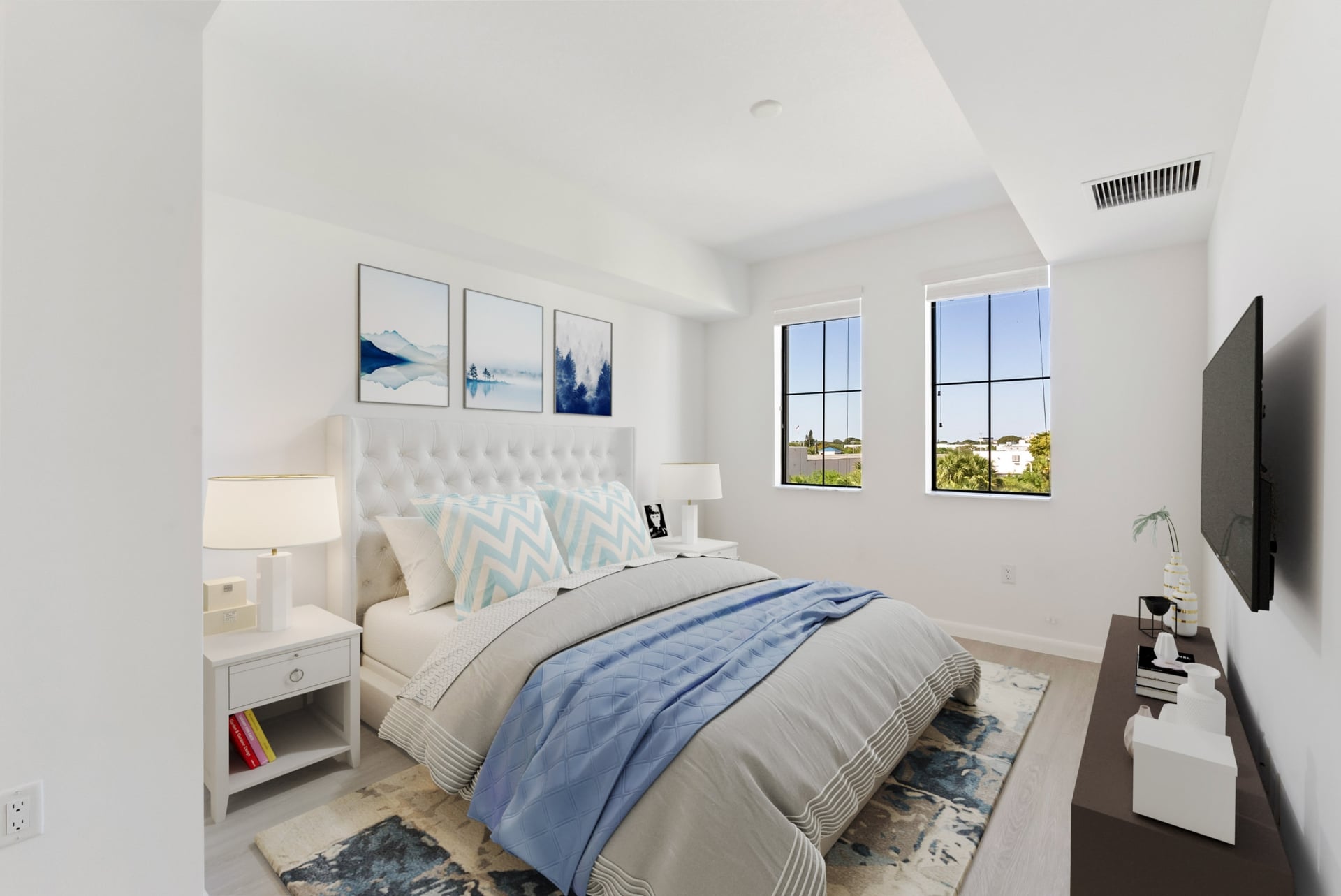 Large windows and bright natural lighting inside apartment bedrooms at Casa Mara