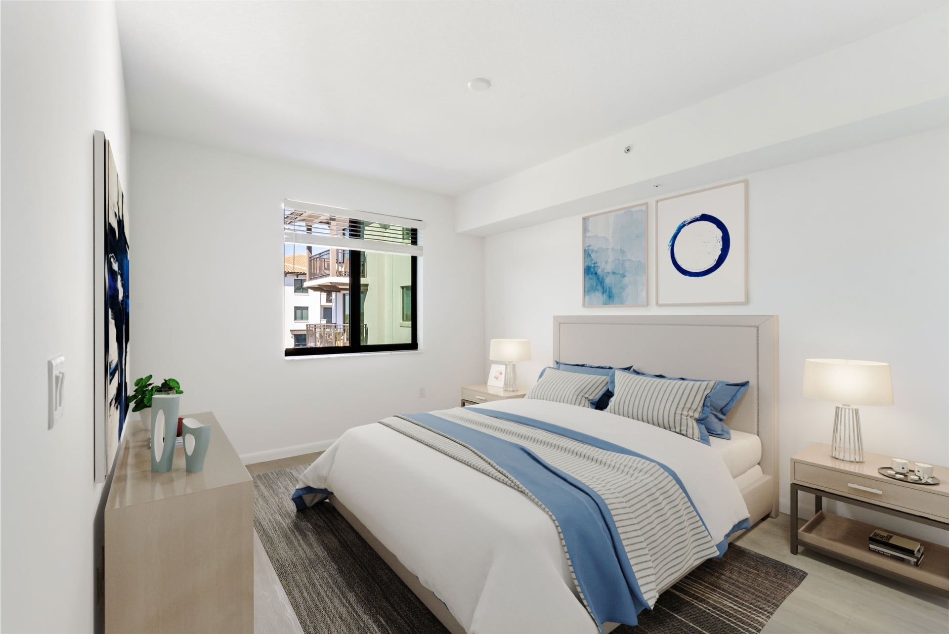 Spacious apartment bedroom with white oak plank flooring inside homes at Casa Mara